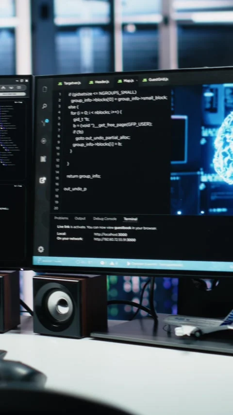 Vertical video Monitors in data center displaying AI tech software interface Stock Footage 313456049