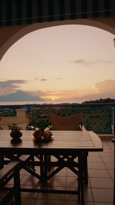 Vertical video Morning light gradually brightens a tranquil balcony Stock Footage 303698524