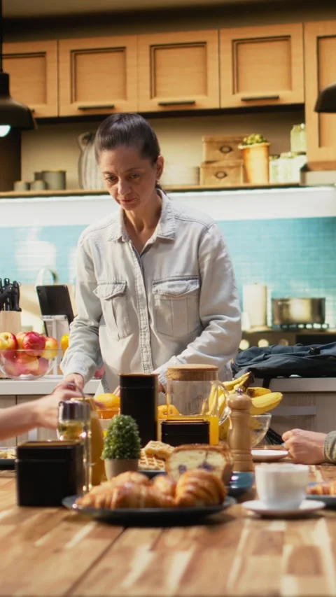 Vertical Video Mother preparing packed lunch in box for daughter at school Stock Footage 327170808