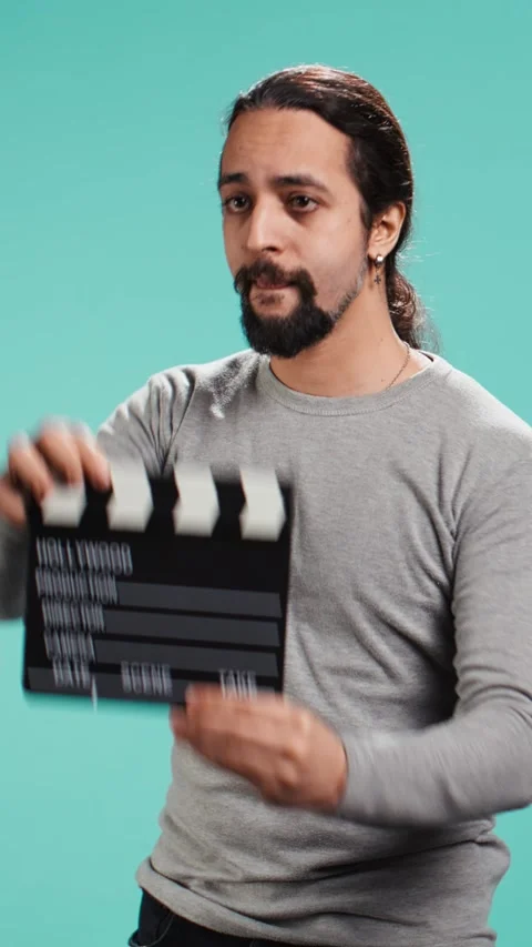 Vertical video Movie director using clapper on set, filming video production Stock Footage 314514947