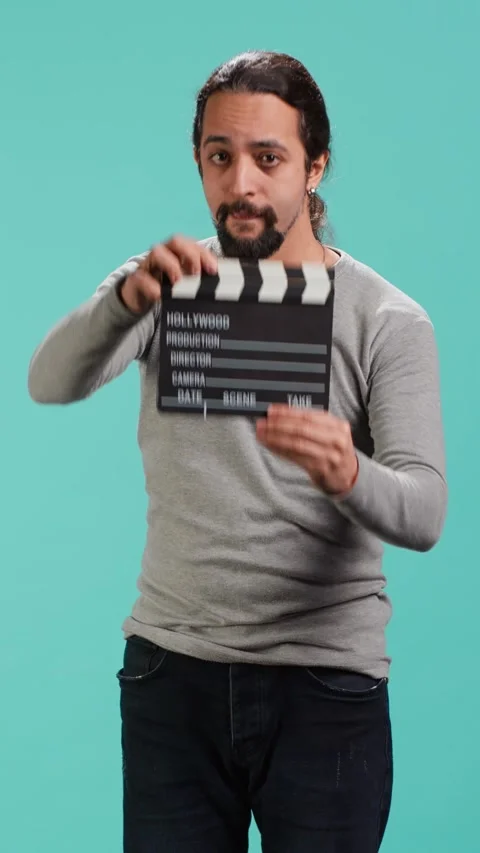 Vertical video Movie director using clapper on set, filming video production Stock Footage 314516235
