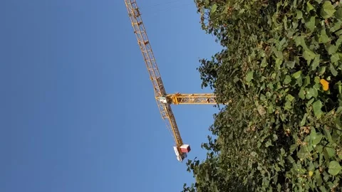 Vertical video of a moving crane Stock Footage 143915769