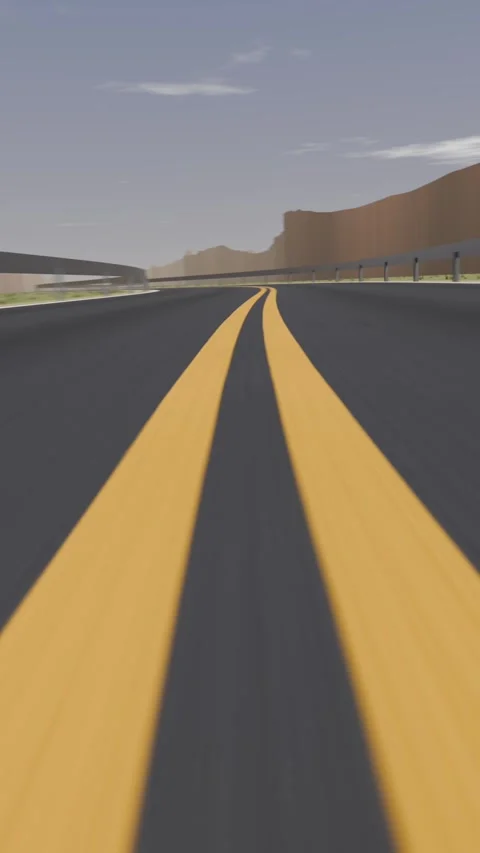 Vertical video: Moving low camera following double yellow lines through canyon Stock Footage 346811381