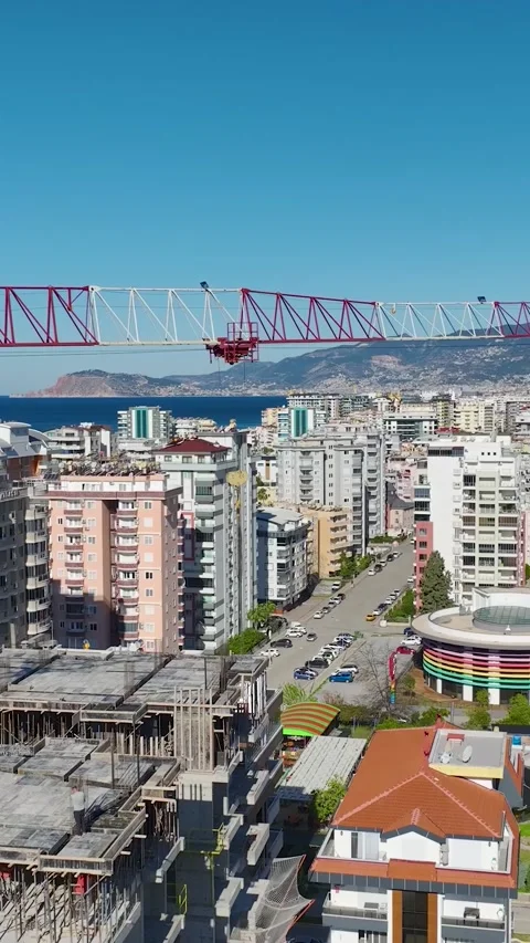 Vertical Video Multi Level Building Under Construction with Crane and Workers Stock-Footage 342463861