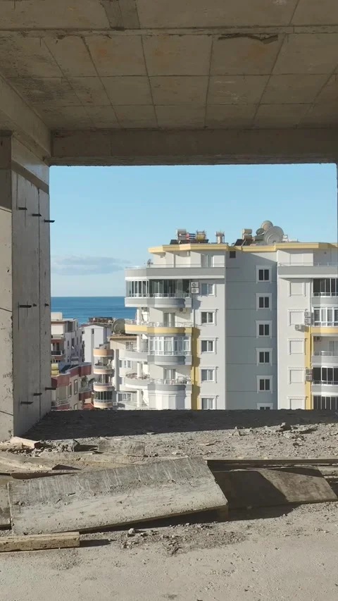 Vertical Video Multi Story Building Under Construction with Exposed Concrete and Stock Footage 342448743