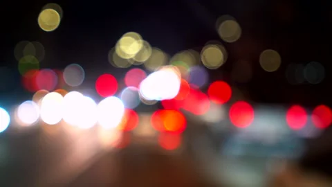 Vertical video with multicolored bokeh lights of night city car traffic Stock Footage 334728108