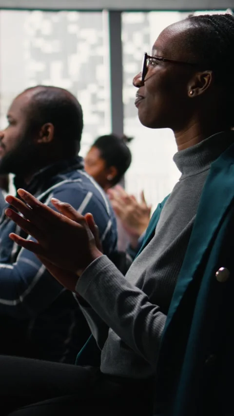 Vertical Video Multiethnic audience applauding and greeting presenter during Stock Footage 327880533