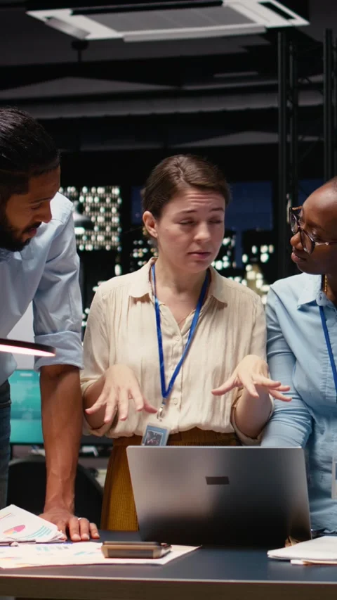Vertical Video Multiethnic team collaborating in modern office workspace at Stock Footage 334103579
