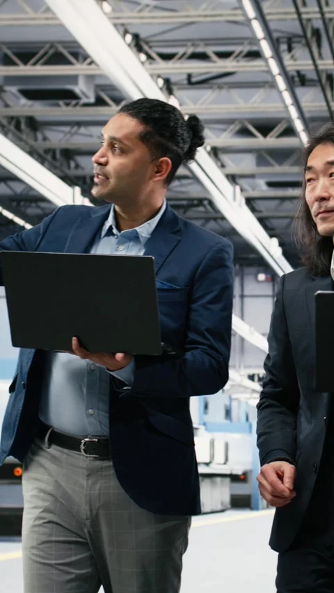 Vertical video Multiracial management executives in microchip foundry Stock Footage 333615235