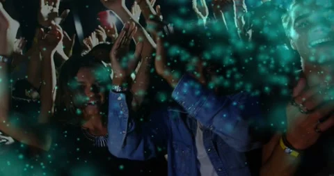Vertical video: Music crowd moving to beat clapping, cheering while teal effect Stock Footage 334036710