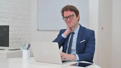 Vertical Video, Neck Pain at Work for Mature Adult Businessman Typing on Laptop Stock Footage 312914999