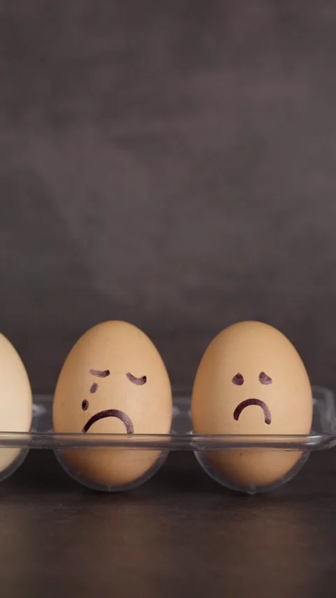 Vertical video, negative emotions, anger and sadness, represented in brown eggs Stock Footage 281372696