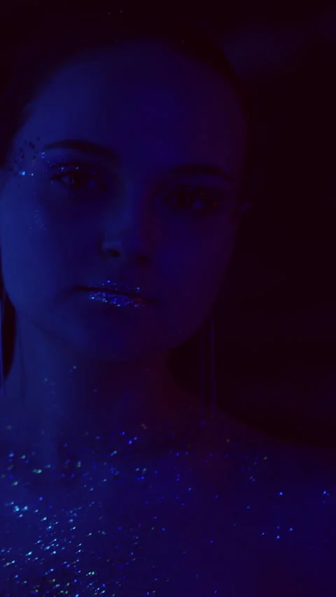 Vertical video neon portrait glitter skin woman Stock Footage 231054726