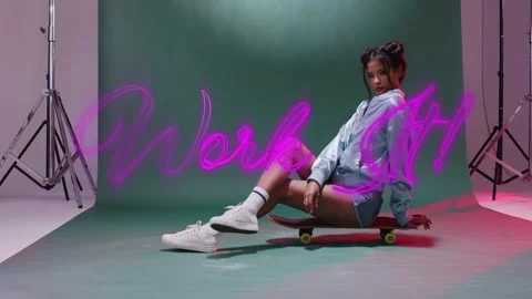 Vertical video: Neon script animating, woman in bomber shifting on skateboard 스톡 동영상 333893755