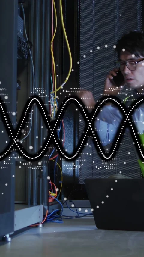 Vertical video: Network tech on call fixing yellow cable at rack testing link 库存影片 332775225