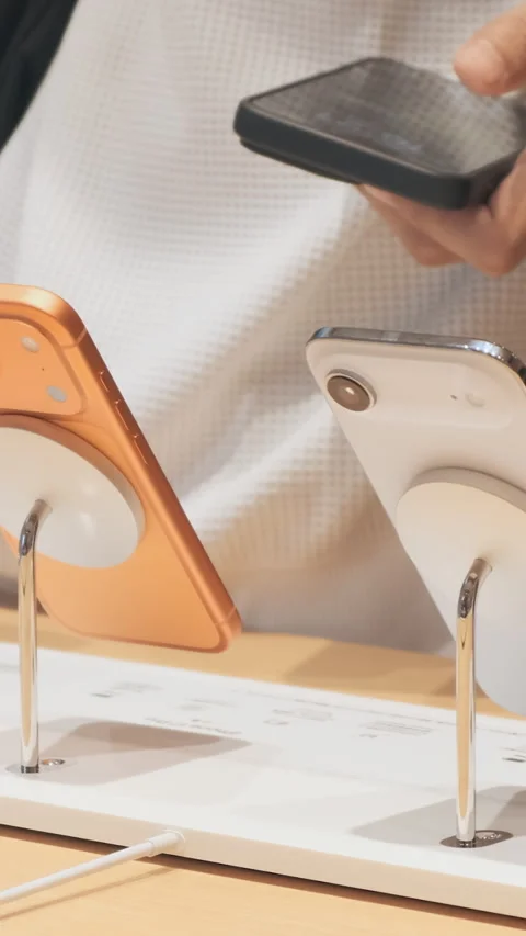 Vertical video: New iPhone 17 lineup on display at the Apple Store, close up Stock Footage 322514777