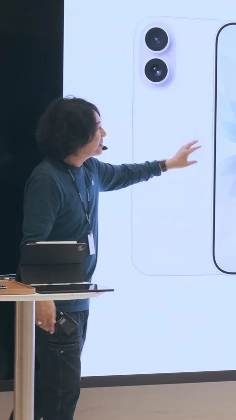 Vertical video: New iPhone 17 lineup presentation in Apple Store launch demo Stock Footage 322515389