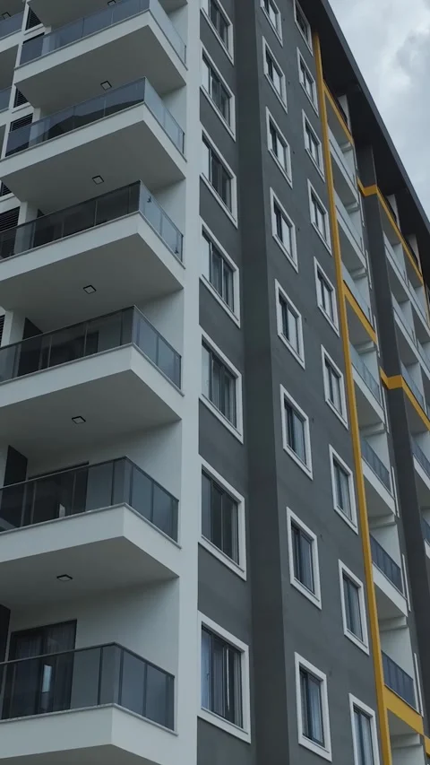 Vertical Video: Newly Built Apartment Complex With Spacious Balconies and a 库存影片 342592332