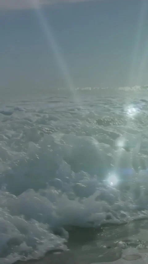 Vertical video: Nodes popping, net shifting while surf rolling and foaming, Stock Footage 334549796