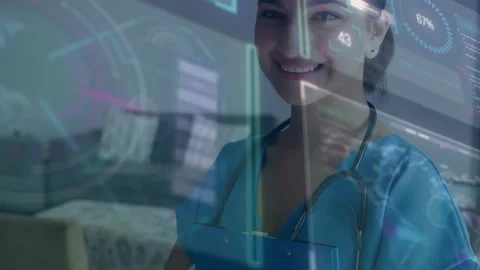 Vertical video: Nurse finishing notes and looking up, smiling as hologram charts Stock Footage 330602172