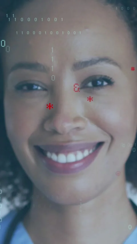 Vertical video: Nurse holding gaze, smiling as teal code and red marks rising Vidéo 330242518