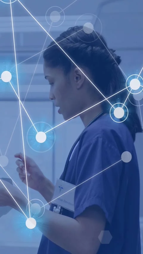 Vertical video: Nurse tapping tablet, animating network nodes over face, torso Stock Footage 332984883