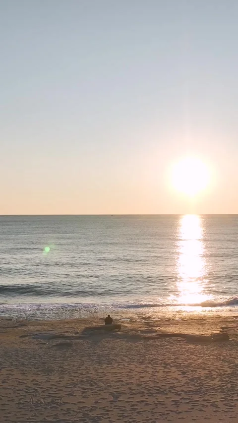 Vertical Video: Ocean Sunset Captured Aerially with Stunning Sunlight Stock-Footage 342673805