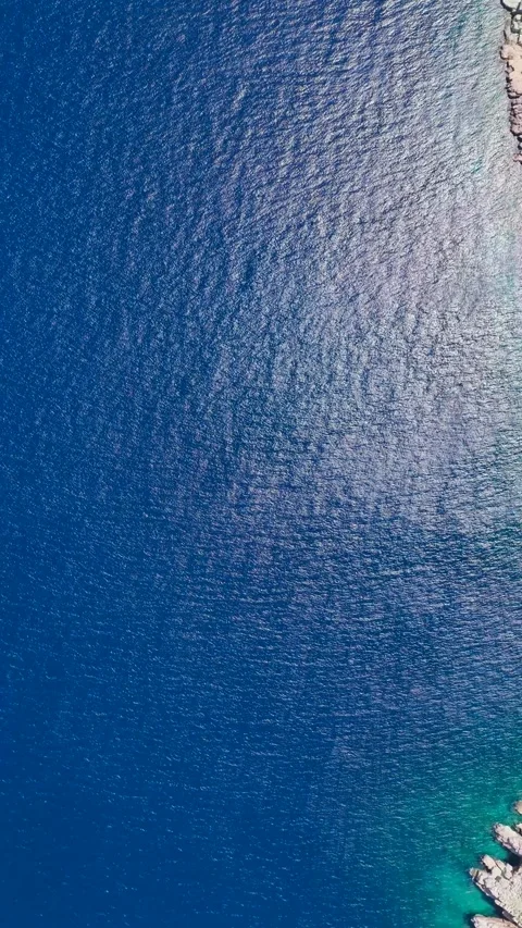 Vertical Video of Ocean Waves Moving Softly Over Clean White Mediterranean Beach Video stock 342296763