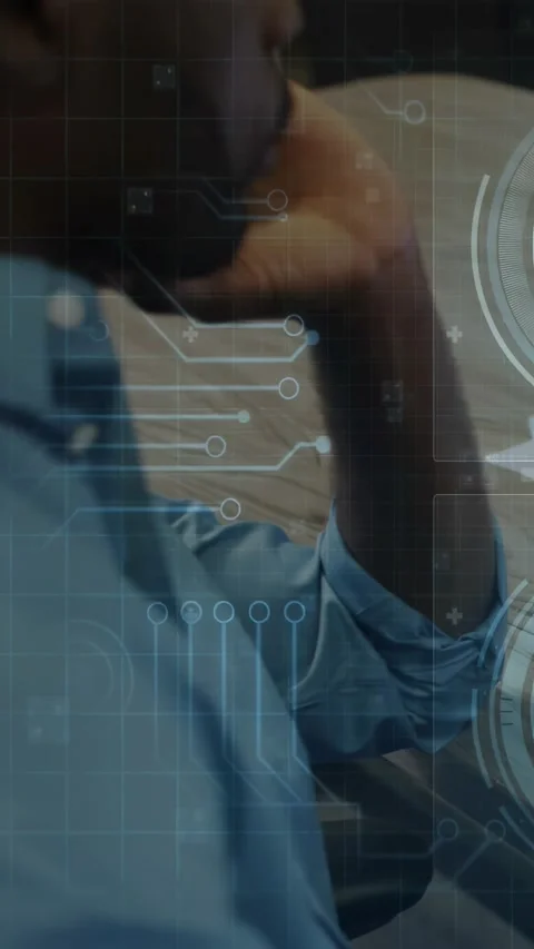 Vertical video: Office analyst resting chin, moving fingers, making tech HUD Stock Footage 334187666