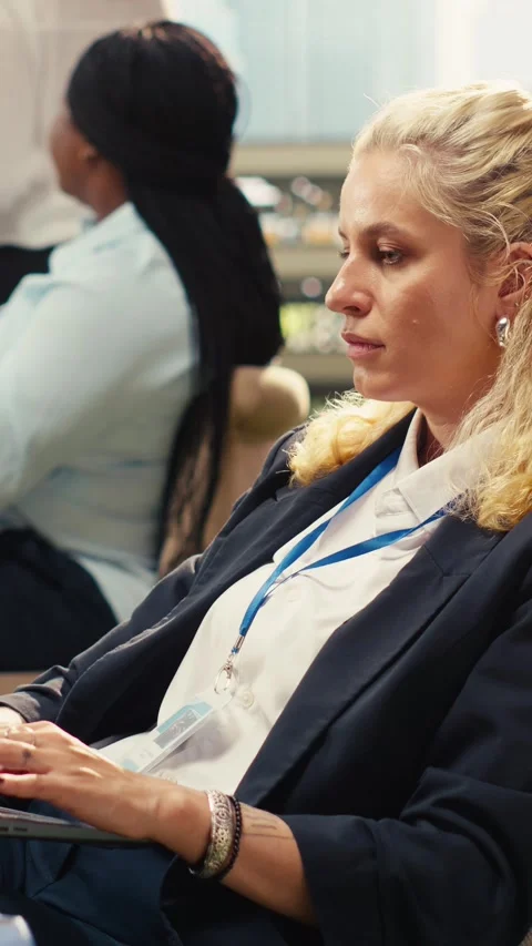 Vertical Video Office employee taking notes on laptop during outdoor planning Stock Footage 339069993