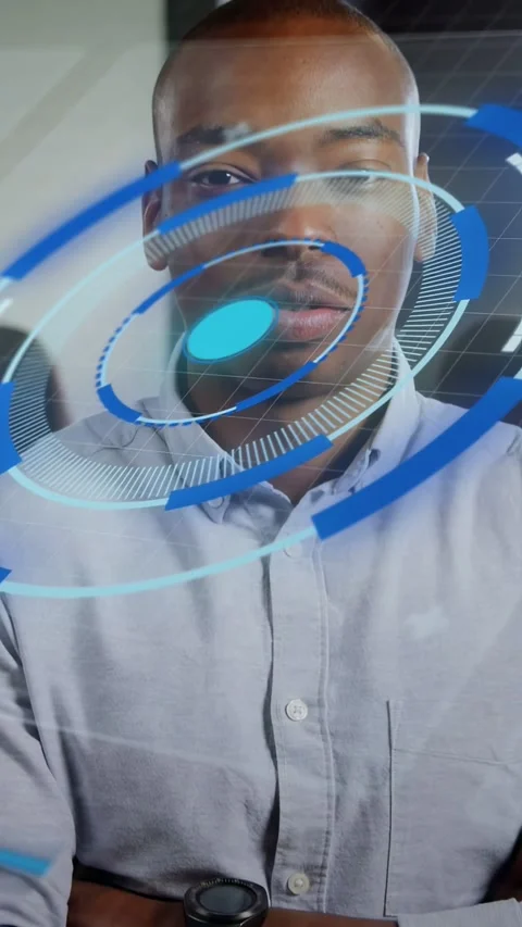 Vertical video: Office man holding arms folded, camera zooming blue AR HUD Stock Footage 333978101