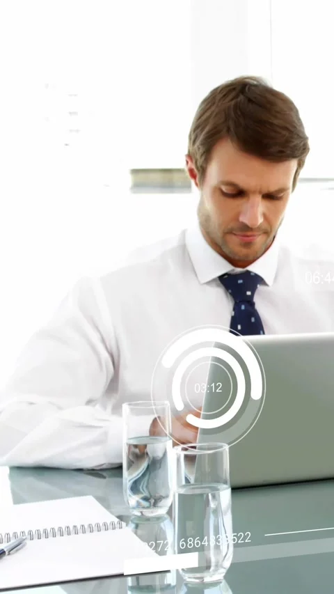 Vertical video: Office mgr typing on laptop starting business HUD timers and Stock Footage 329128606