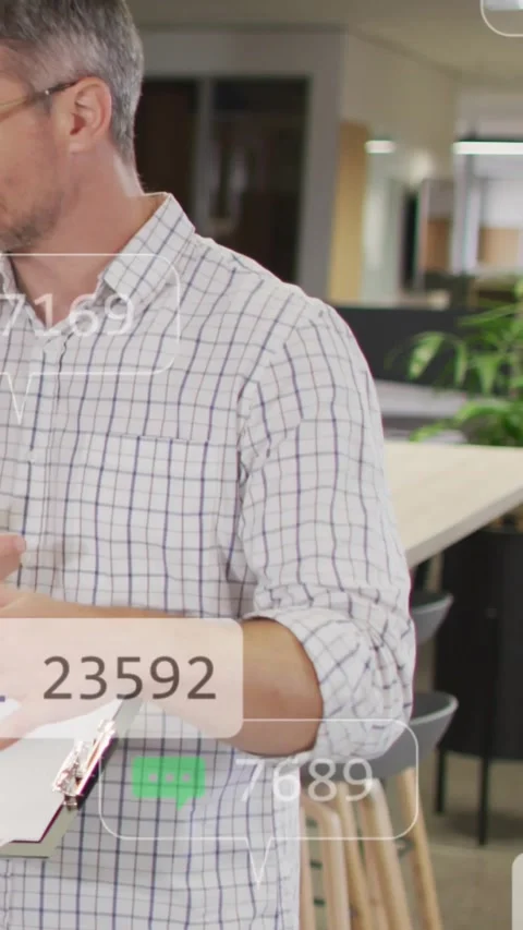 Vertical video: Office presenter checking clipboard and showing marketing data, Stock Footage 334547096