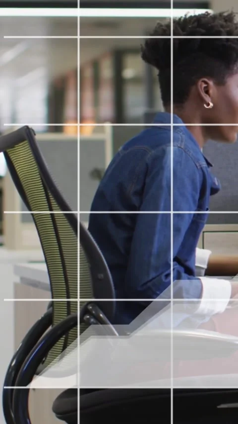 Vertical video: Office worker leaning and typing on keyboard in mesh chair, Stock Footage 334550514