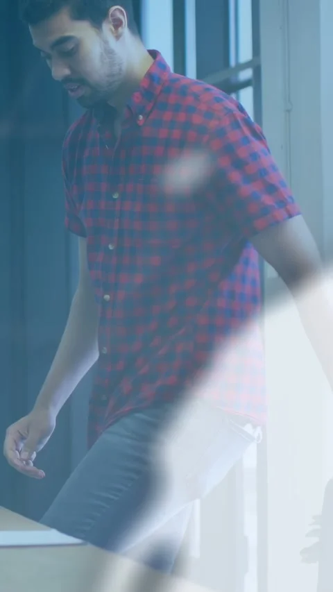 Vertical video: Office worker pulling chair and preparing to sit at desk as UI Video stock 333174983