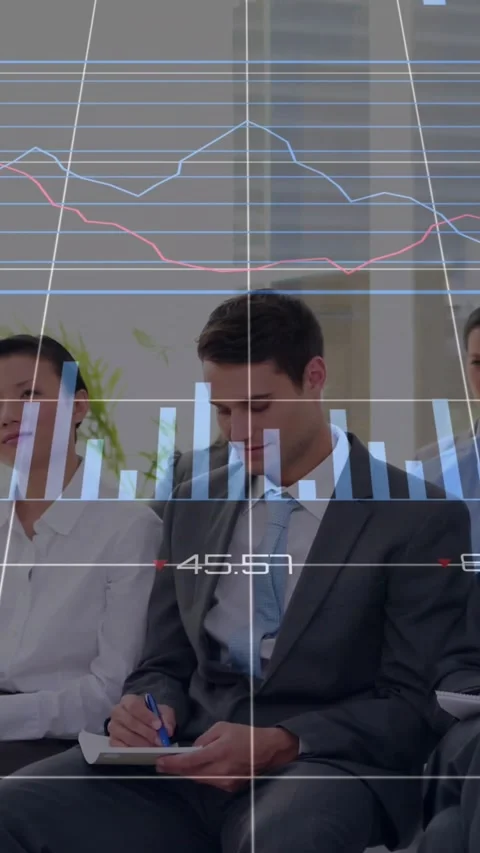 Vertical video: Offscreen speaker showing finance graphs, man taking notes, Video stock 331738962