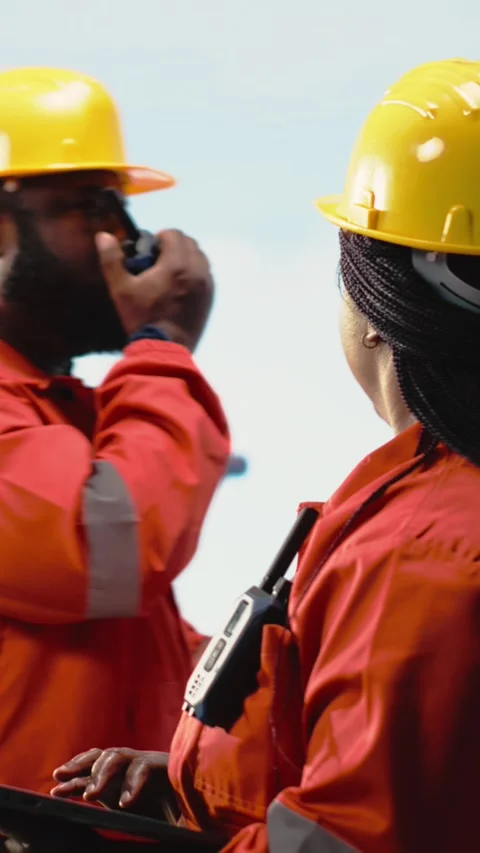 Vertical video Offshore platform specialist using monitoring software on laptop Stock Footage 319451123