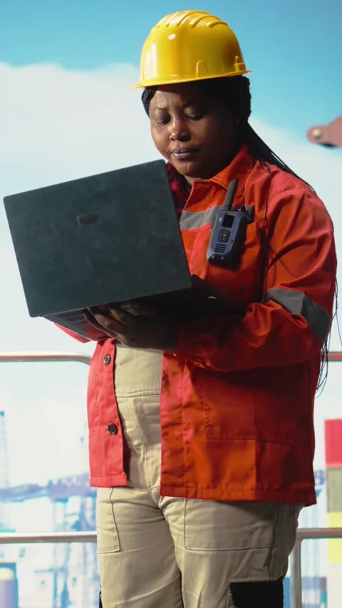 Vertical video Offshore platform specialist using monitoring software on laptop Stock Footage 319713891