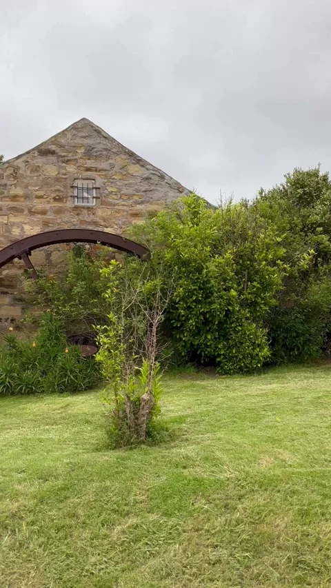 Vertical video of an old watermill turned on into a house Stock Footage 317952177