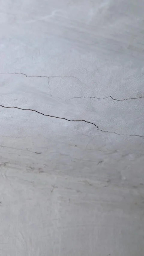 Vertical video. Old white abandoned cement ceiling with cracks and cobwebs. Stock Footage 294670993