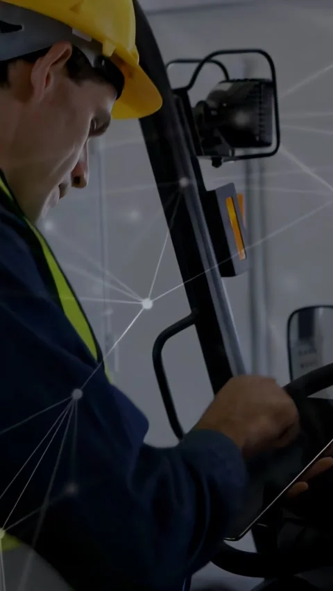 Vertical video: Operator settling into warehouse cab, gripping wheel and using Stock Footage 332317400