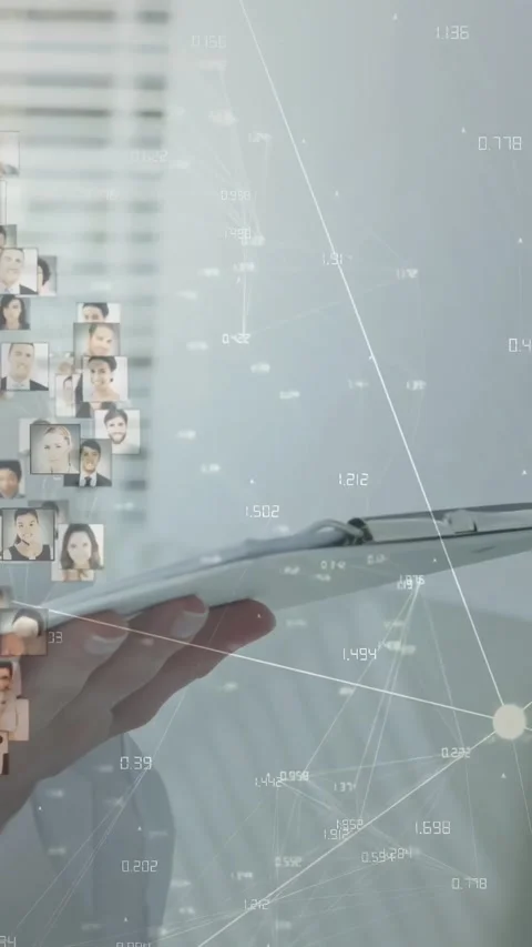 Vertical video: Operator using stylus, animating network nodes and thumbnails on Stock Footage 334543910