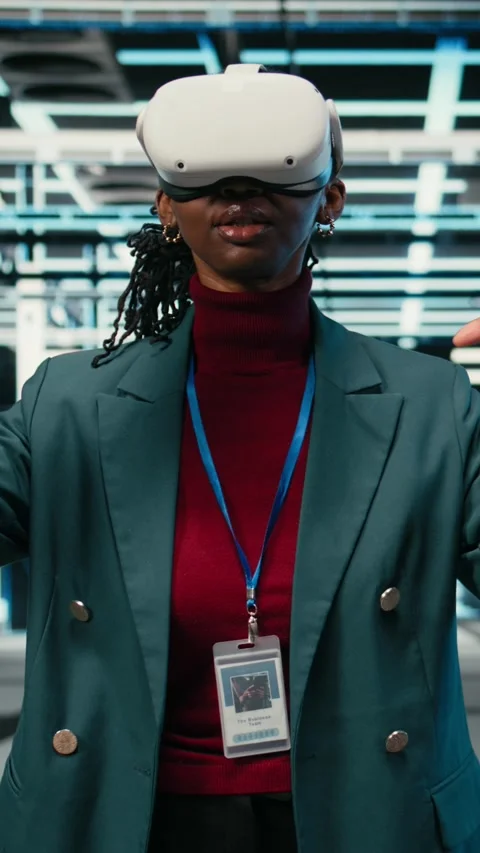 Vertical video Optimizing gear rigs, VR glasses and female engineer in data Stock Footage 329529992