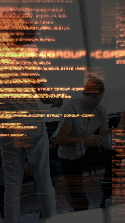 Vertical video: Orange code starting, standing man reaching, seated man checking Stock Footage 333259506
