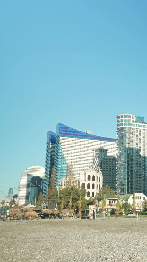 Vertical video Orbi City view, fast flow of people on the embankment. Timelapse Stock Footage 335850648