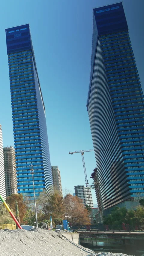 Vertical video Orbi City view from embankment, fast flow of people walking. Stock Footage 335851035
