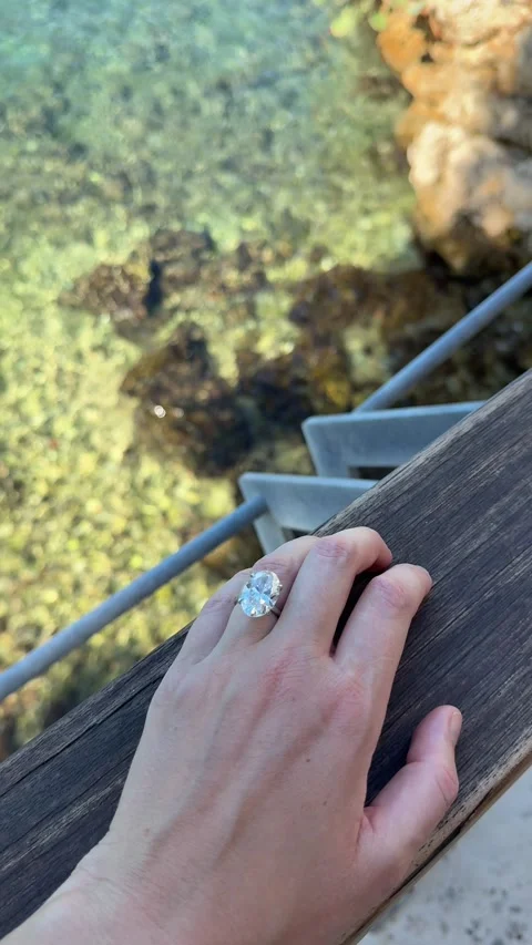 Vertical video of oval diamond ring by clear blue sea in Croatia Stock Footage 319692157