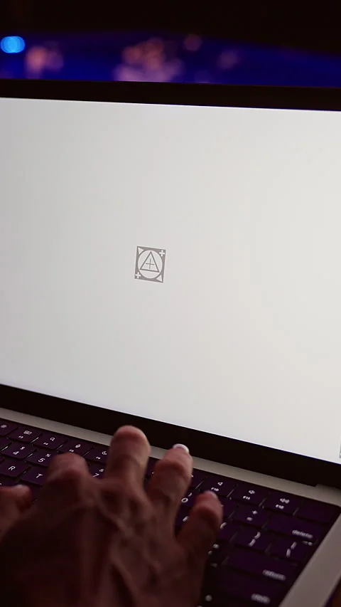 Vertical video. Over Shoulder View Of Person Using Laptop With Blank Screen Mock Stock Footage 336699304
