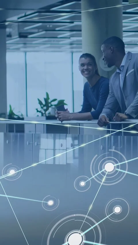 Vertical video: Pair settling on railing discussing project, tech nodes Stock Footage 332984983