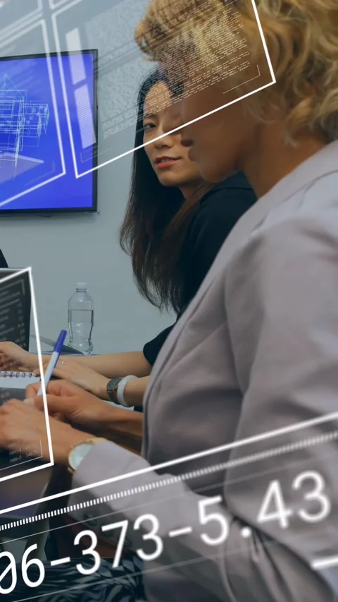 Vertical video: Pair taking notes while screen schematic appearing, data Stock Footage 332985038